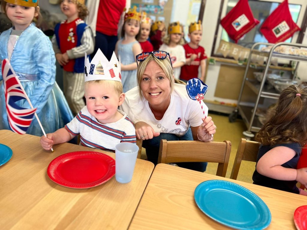 Nursery staff and children celebrate the Coronation together