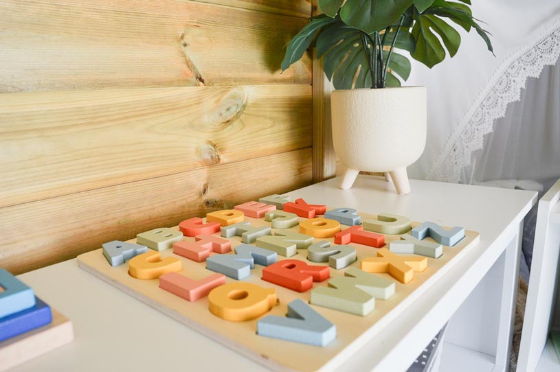 a children's play table with tactile letters set up